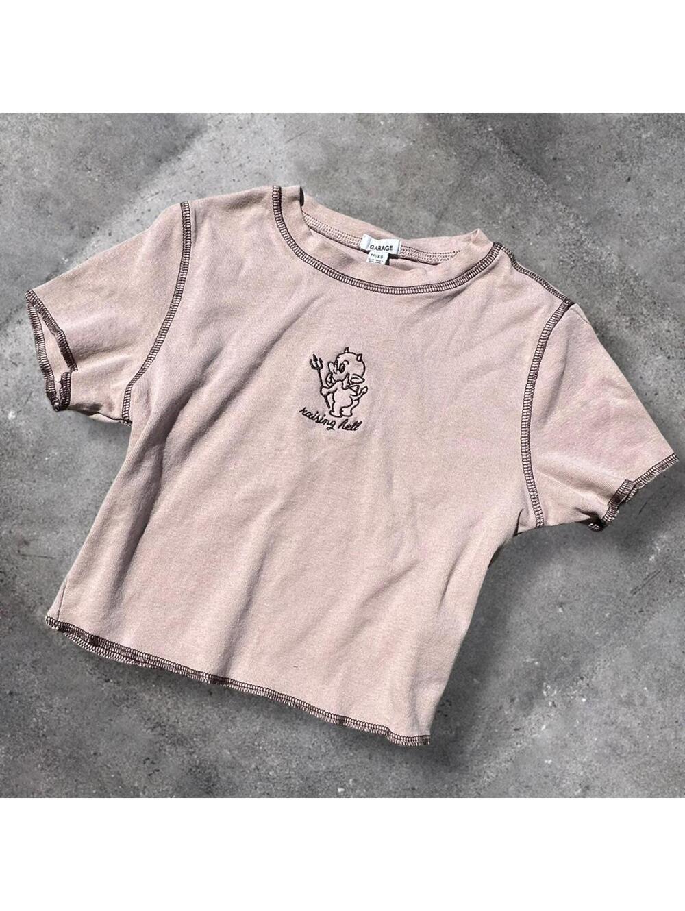 ‘raising hell’ graphic cropped baby tee